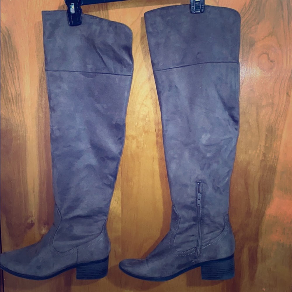 Over the knee tan boots.